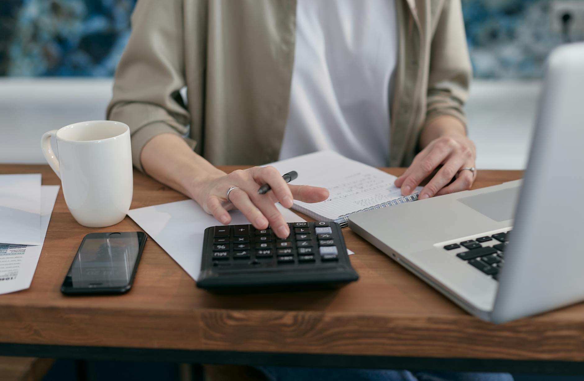A person reviewing financial data on a laptop, demonstrating budget management.